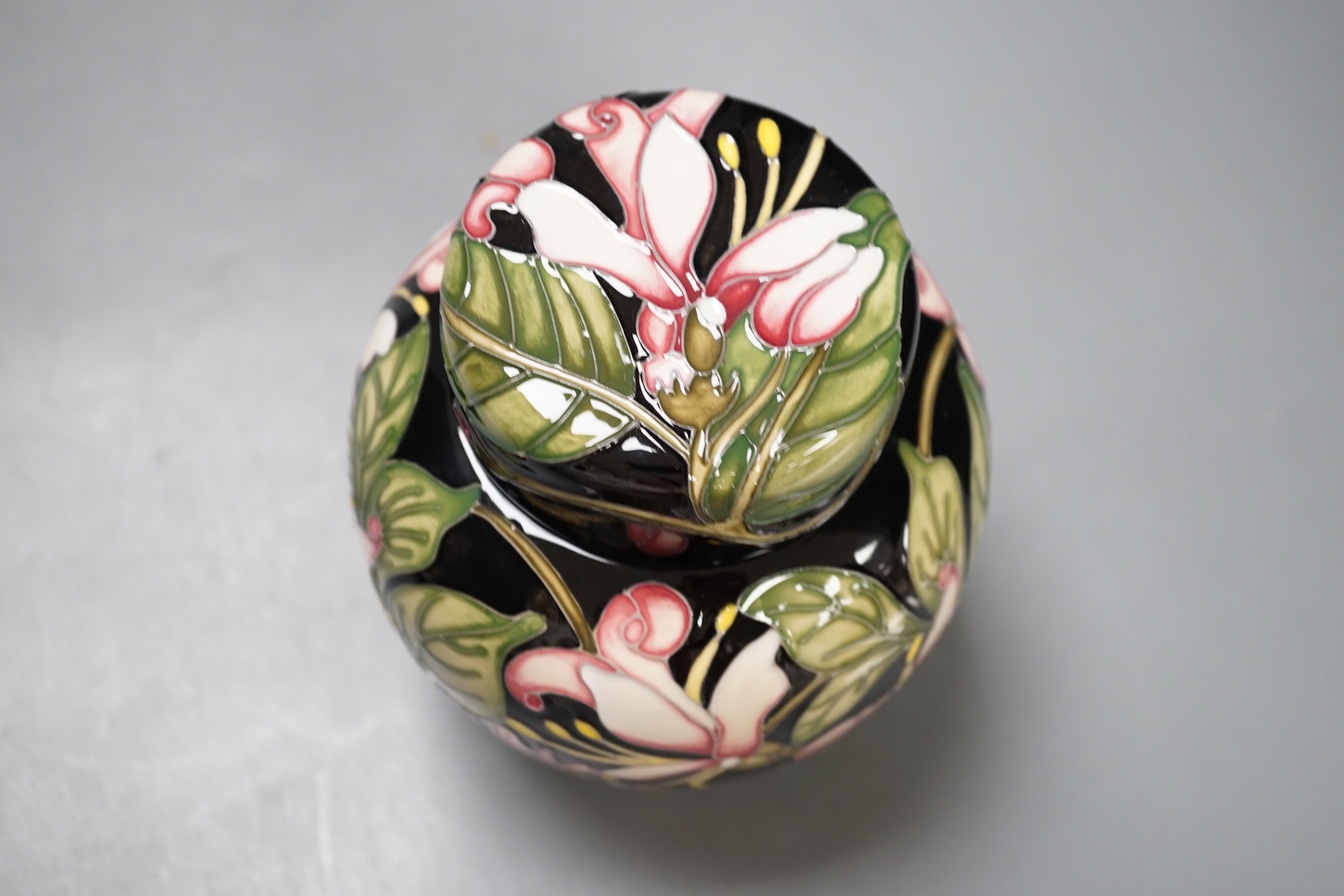 A Moorcroft 'Karzai honeysuckle' jar and cover, by Kerry Goodwin, numbered edition 769/6, 2012, boxed, 15 cms high.